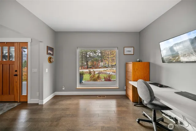 a view of a dining room with furniture window and outside view
