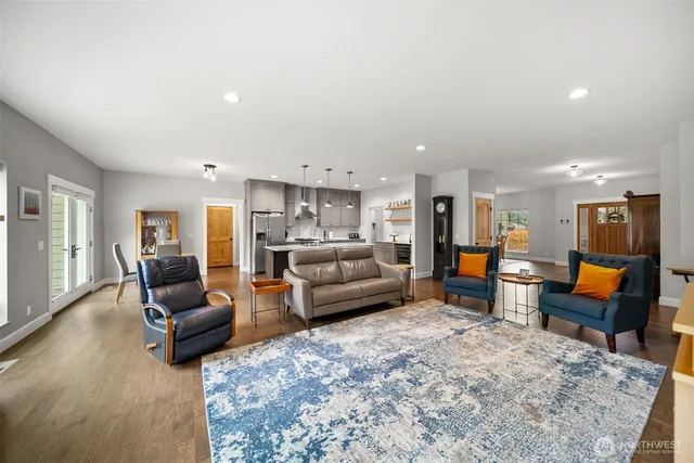 a living room with furniture a window and a fireplace