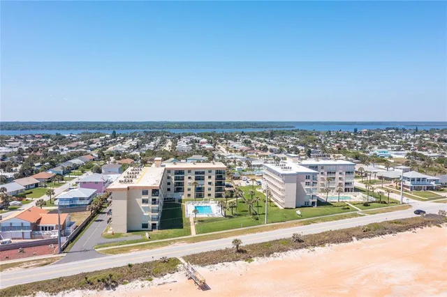 a view of a swimming pool and a big yard