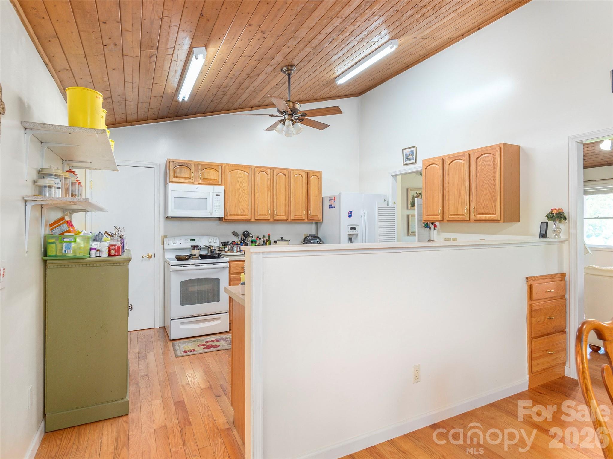 1120 Jacobs Branch Road Franklin, NC 28734 - Photo 12 of 36 a kitchen with stainless steel appliances a refrigerator and a stove