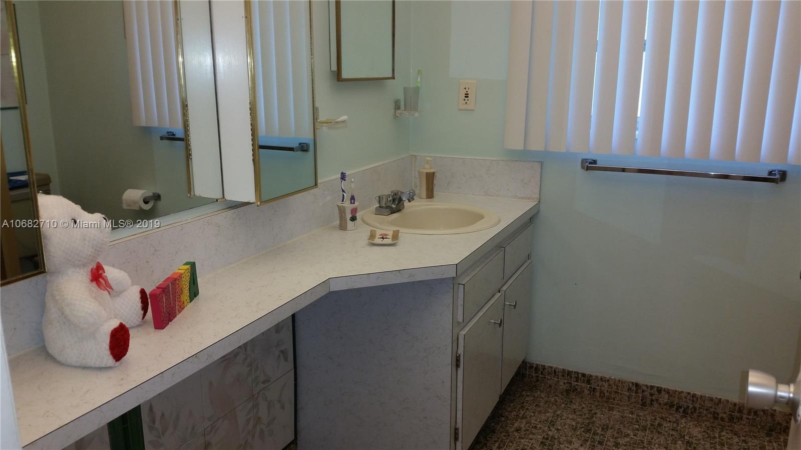 West Perrine Miami, FL 33157 - Photo 11 of 25 a bathroom with a sink and a mirror
