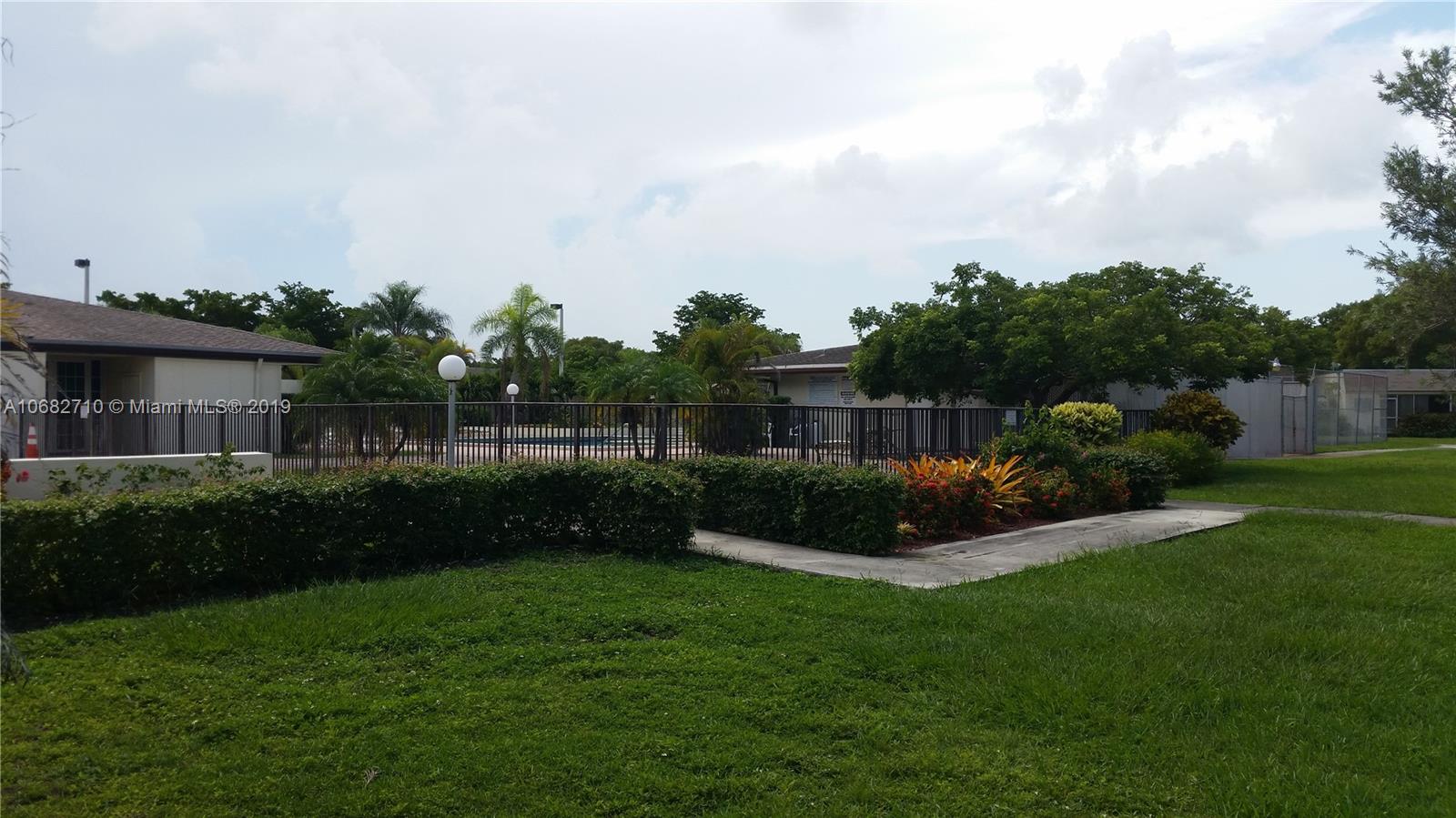 West Perrine Miami, FL 33157 - Photo 21 of 25 a front view of a house with garden