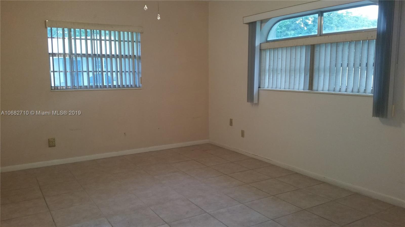 West Perrine Miami, FL 33157 - Photo 9 of 25 an empty room with windows