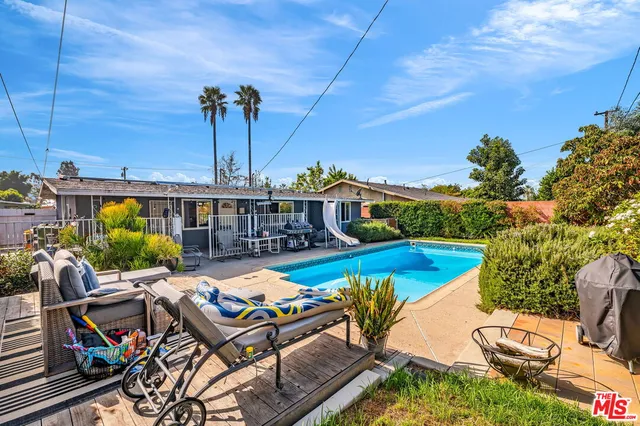 a view of a swimming pool with a patio