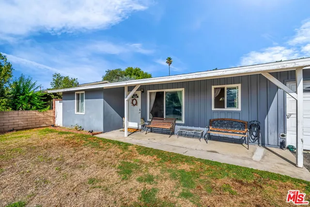 a view of a swimming pool with a lawn chairs