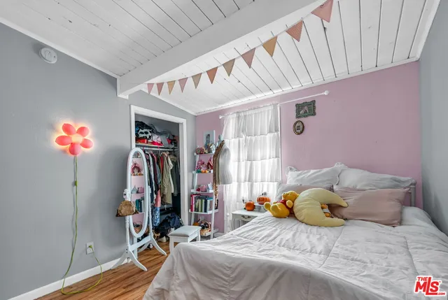 a bedroom with furniture and a bed