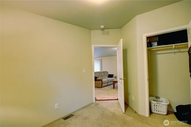 a view of a hallway with a room