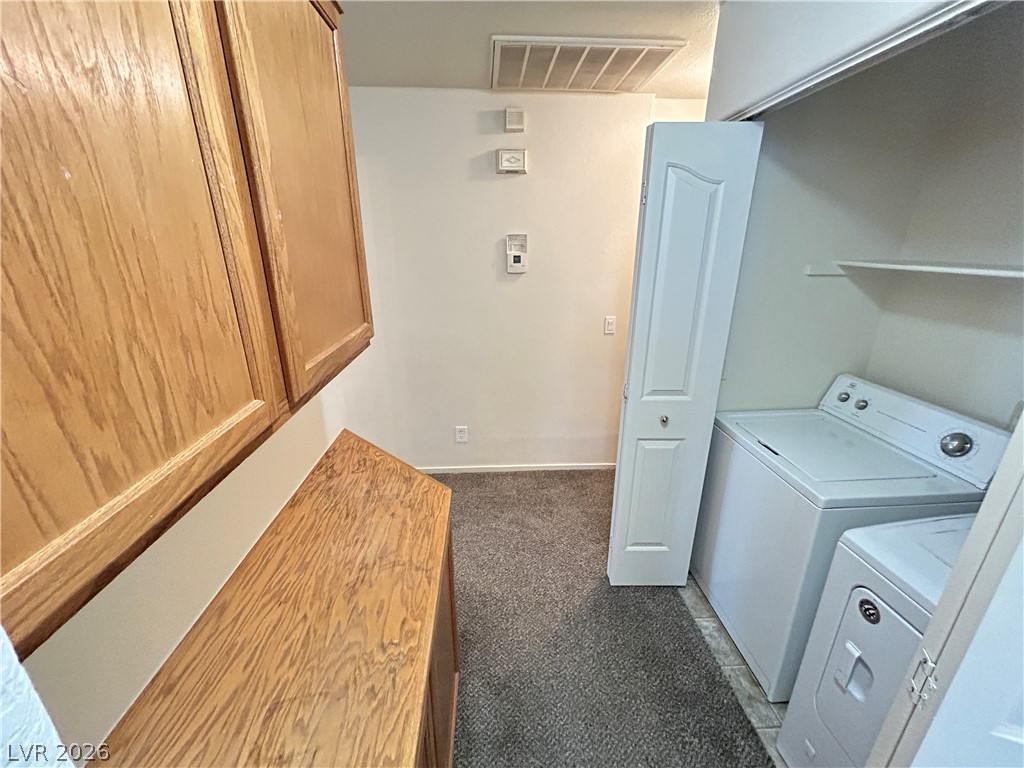 1840 Montvale Las Vegas, NV 89134 - Photo 15 of 31 Functional utility space with carpeted flooring and practical laundry appliances.