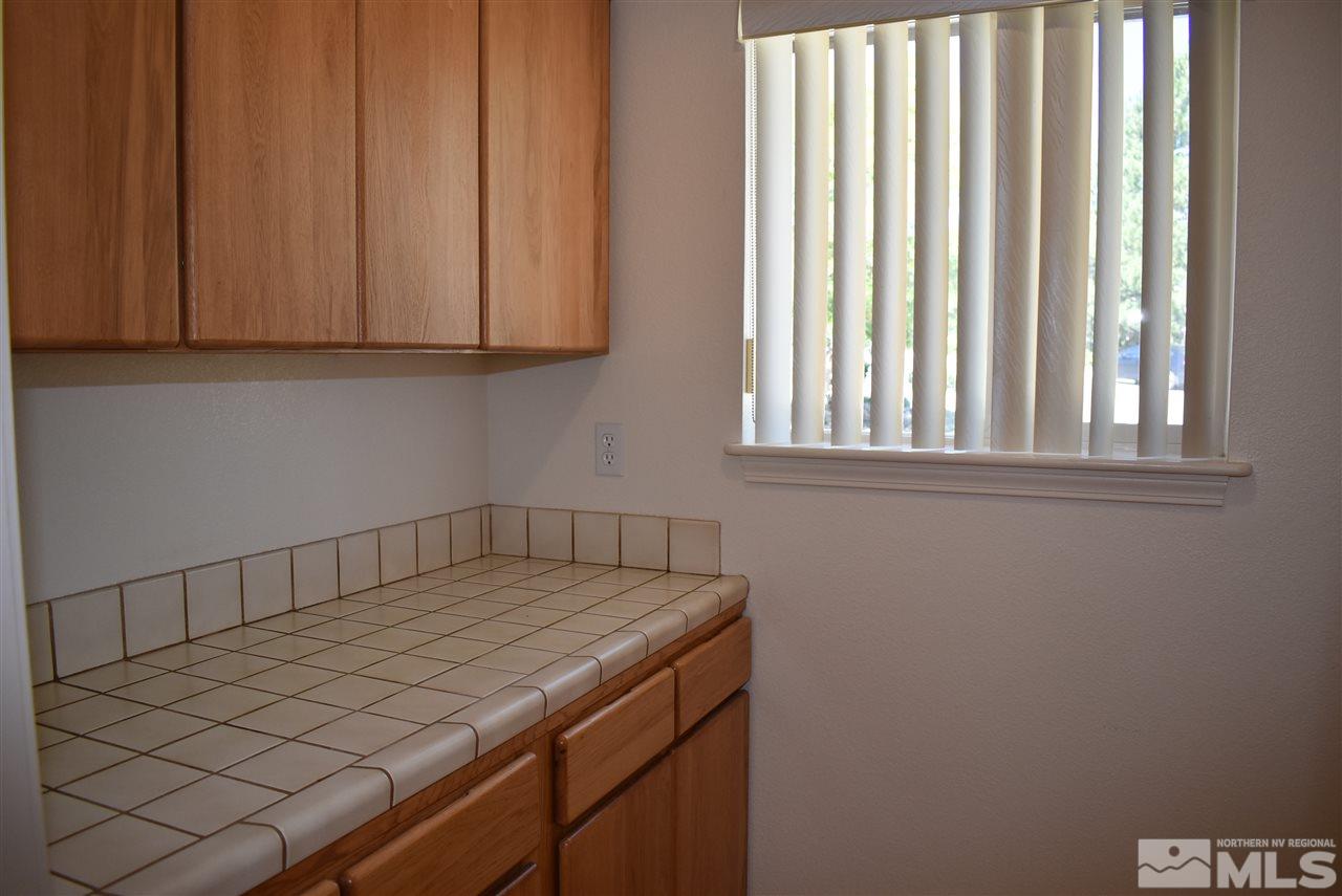 20 Ocelet Way Reno, NV 89511 - Photo 21 of 25 a room with a bed and a window