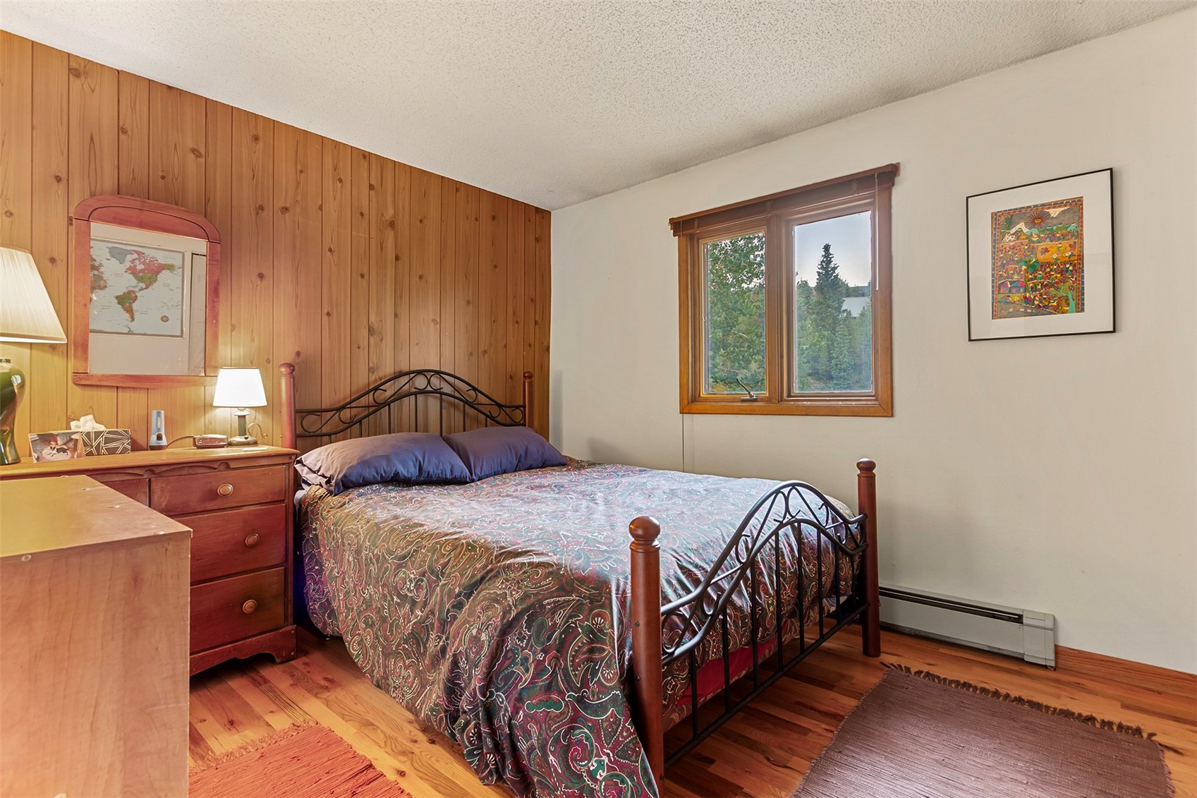 857 Deer Path Road Dillon, CO 80435 - Photo 18 of 29 a bedroom with a bed and wooden floor