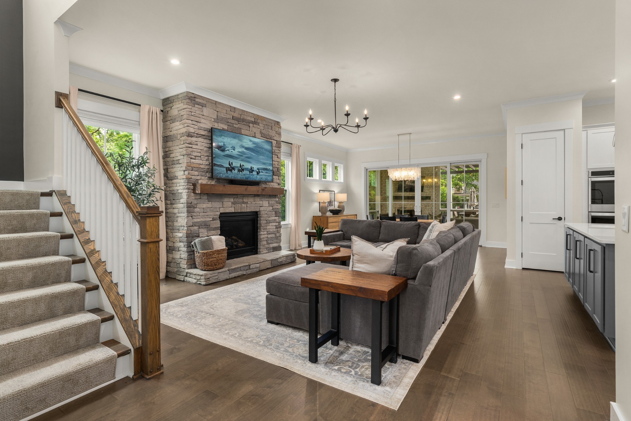 454 Cardel Lane Franklin, TN 37064 - Photo 11 of 53 a living room with furniture a fireplace and a flat screen tv