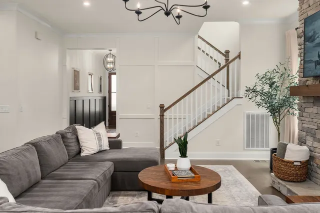 a living room with furniture and a table