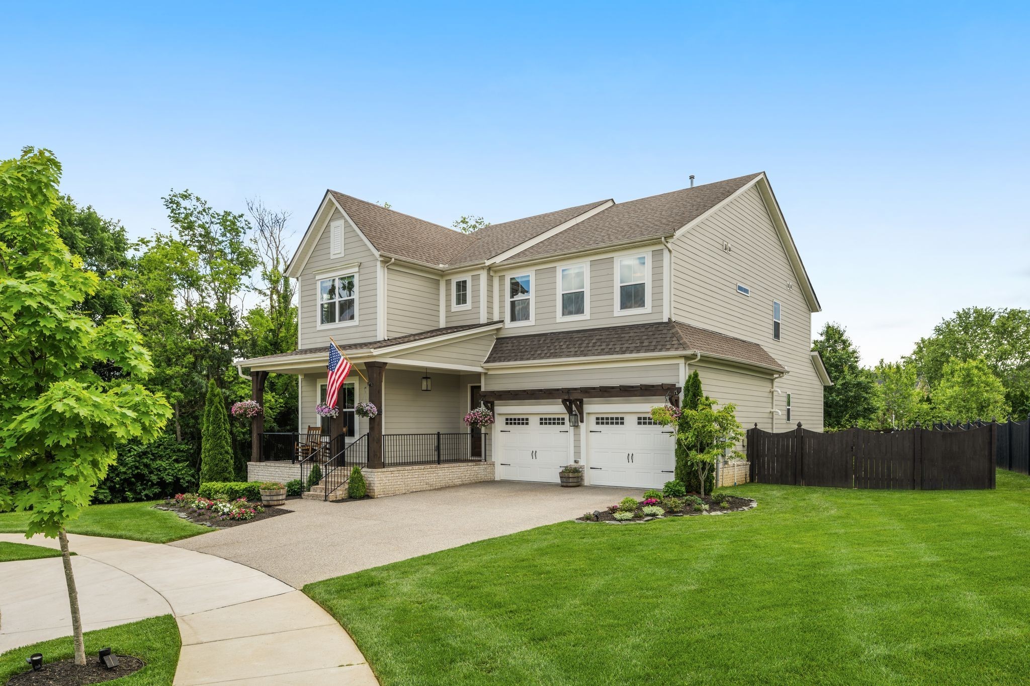 454 Cardel Lane Franklin, TN 37064 - Photo 2 of 53 a front view of a house with a garden