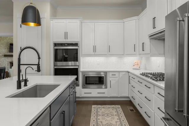 a kitchen with cabinets and appliances