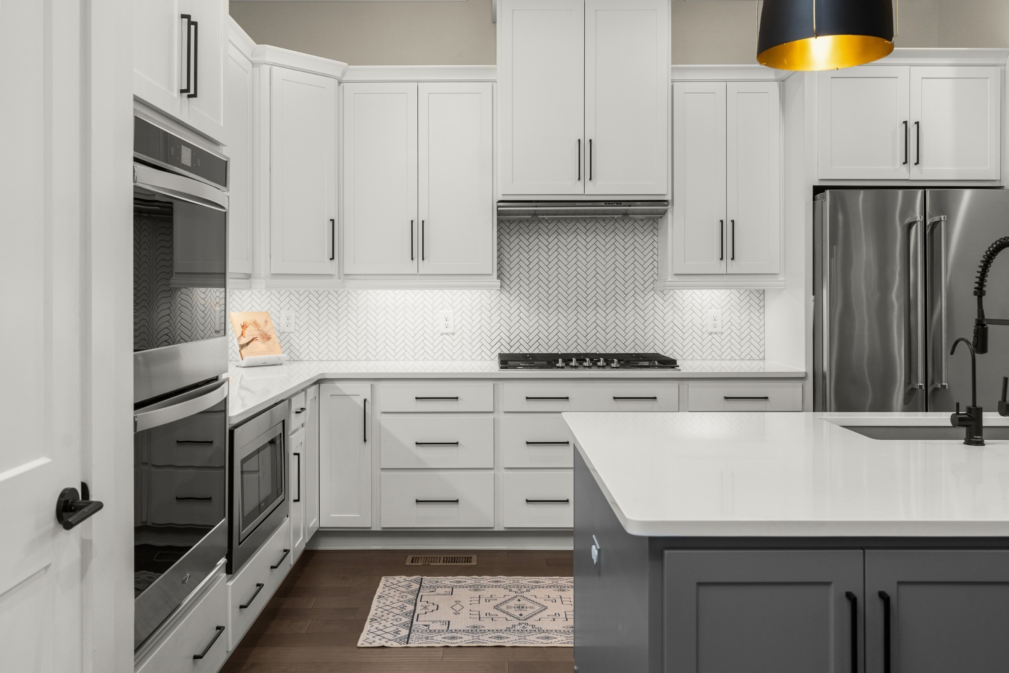 454 Cardel Lane Franklin, TN 37064 - Photo 23 of 53 a kitchen with a sink a stove and refrigerator