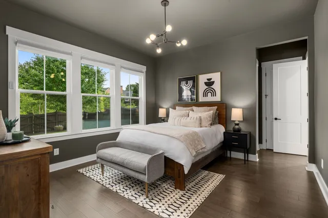 a bathroom with a tub sink vanity and shower