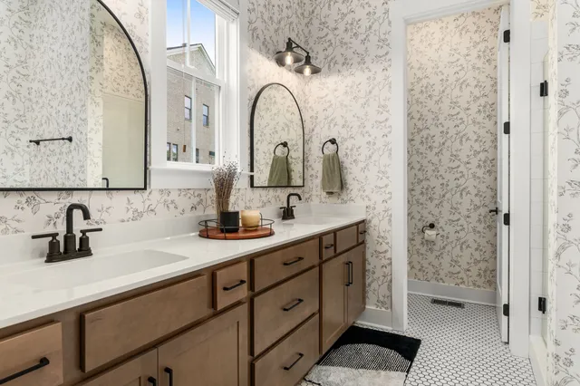 a bedroom with a bed window and a table