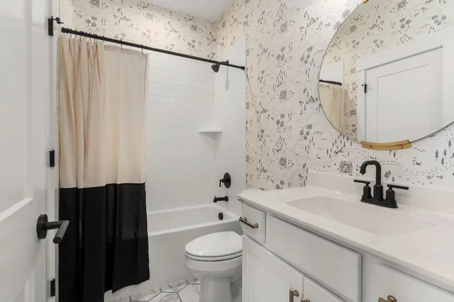 a en suite bathroom with double sink and a mirror