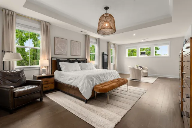 a living room with furniture a fireplace and wall paintings