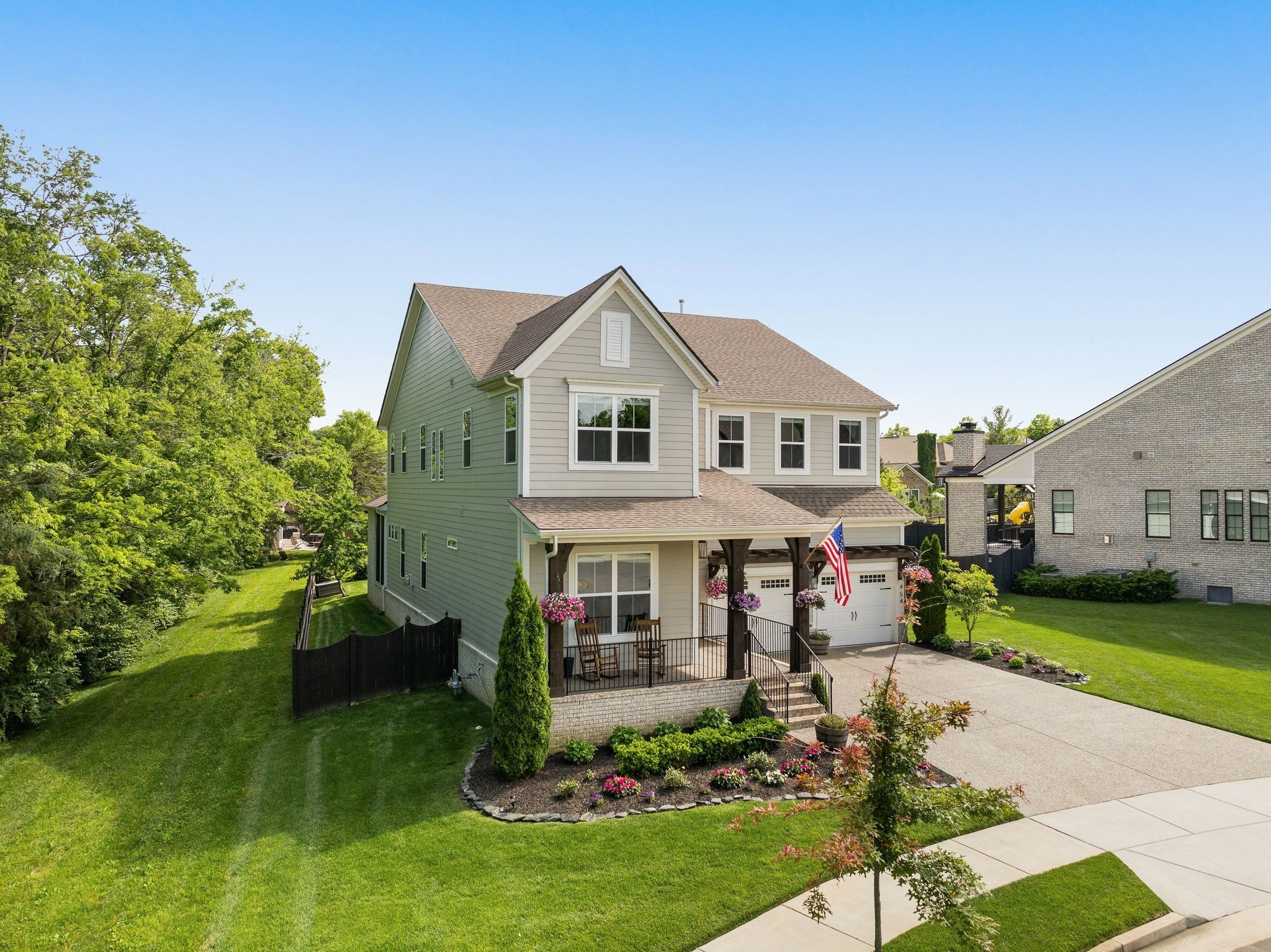 454 Cardel Lane Franklin, TN 37064 - Photo 4 of 53 a front view of a house with garden