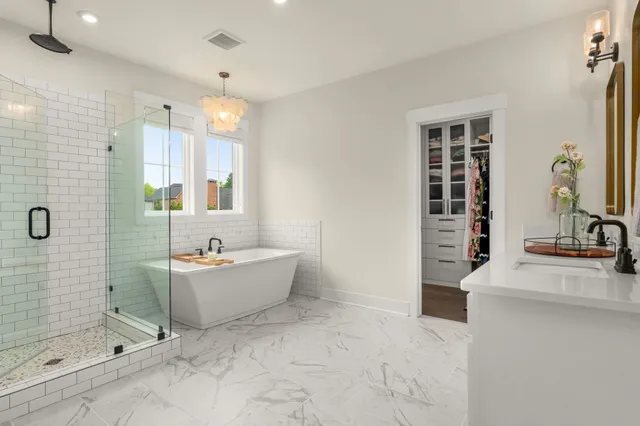 a bathroom with double vanity sink and a mirror