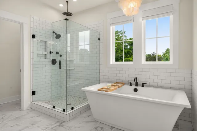 a bathroom with a bathtub and window