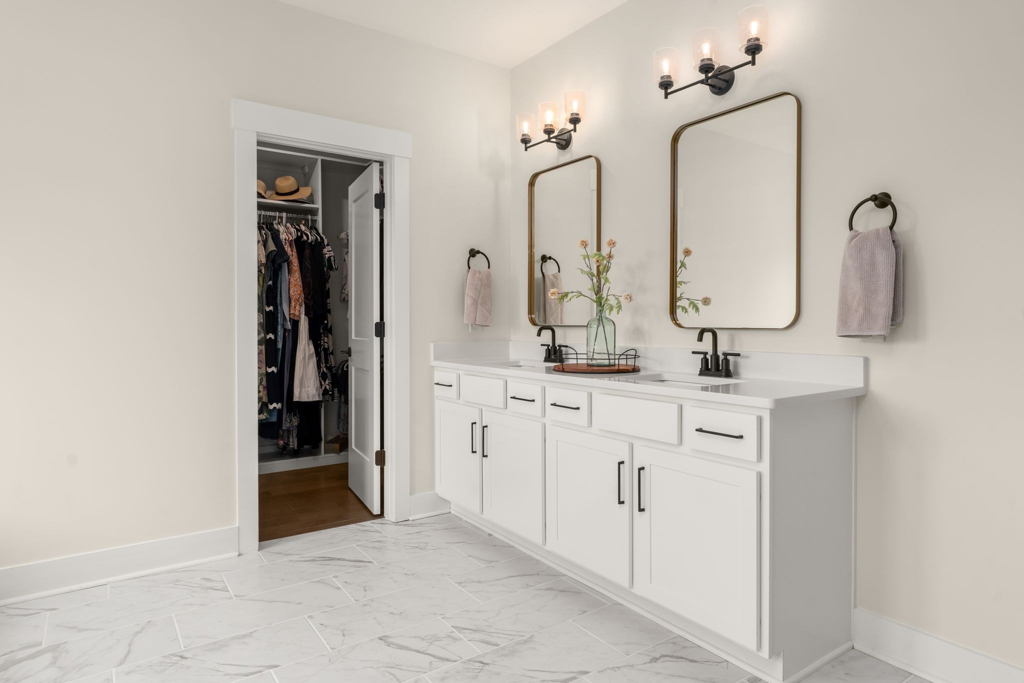 454 Cardel Lane Franklin, TN 37064 - Photo 43 of 53 a bathroom with double vanity sink and a mirror