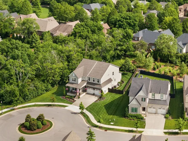 an aerial view of a house with lake view