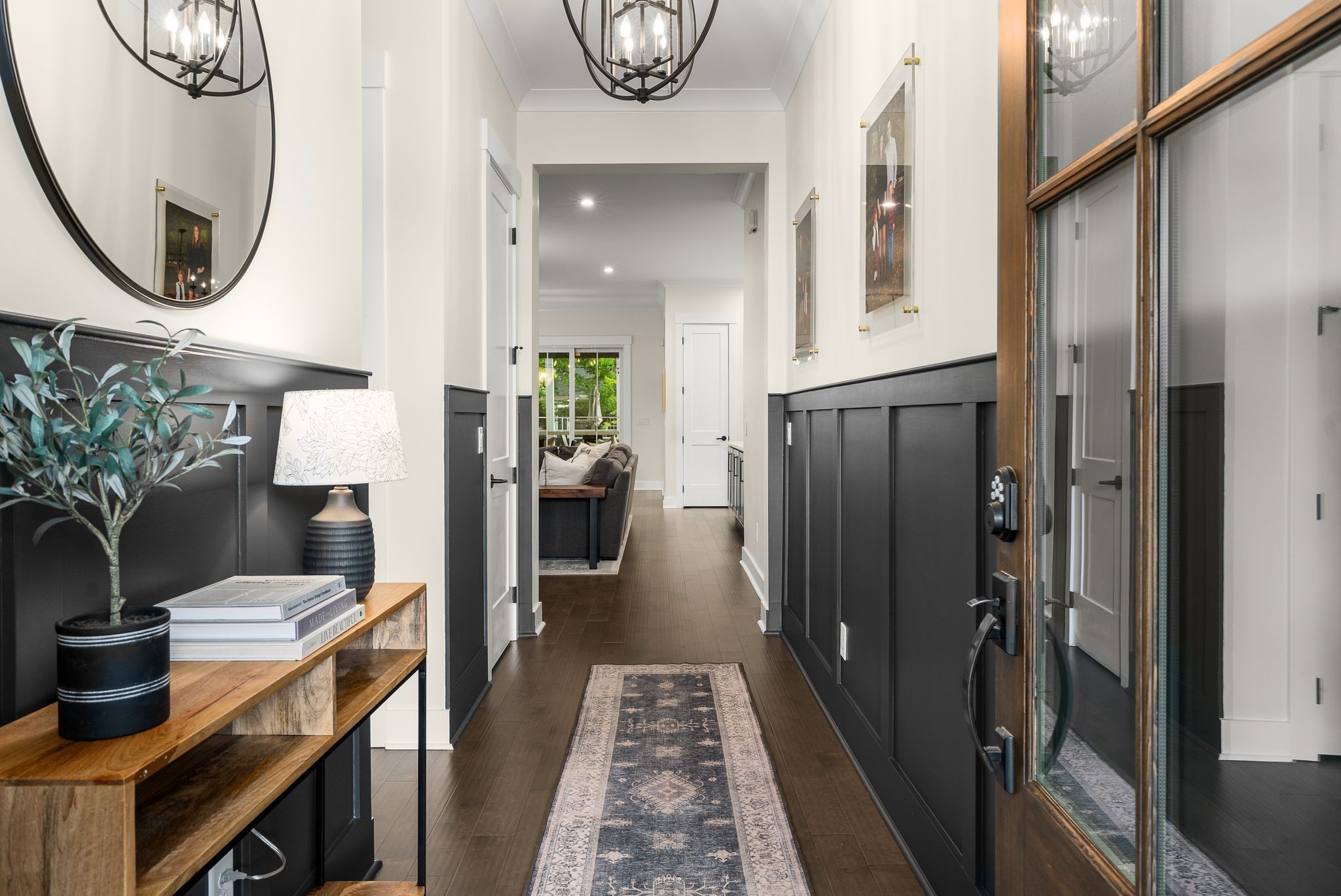 454 Cardel Lane Franklin, TN 37064 - Photo 8 of 53 a hallway with dining area and chandelier