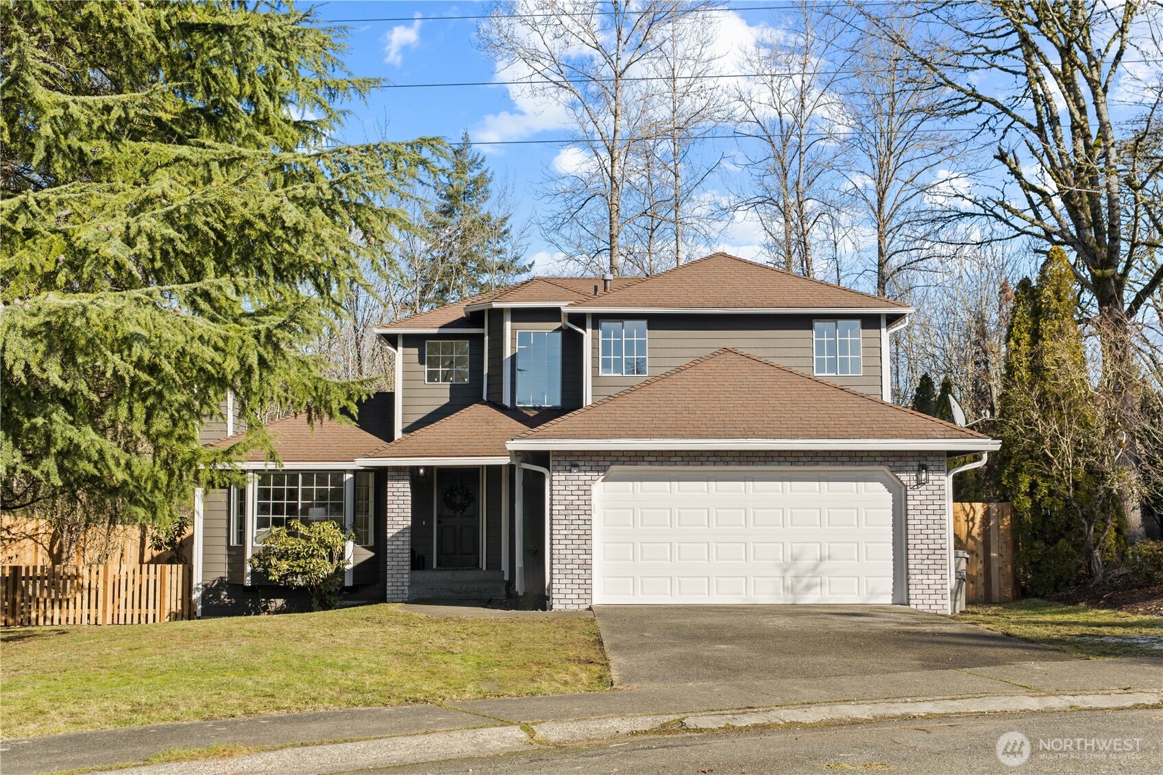 18307 130th Avenue Southeast Renton, WA 98058 - Photo 1 of 36 a front view of a house with a yard