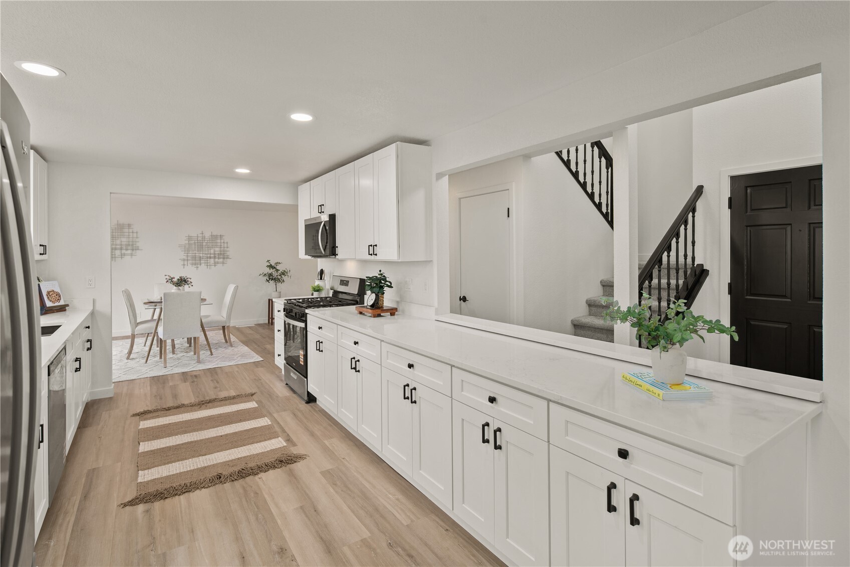 18307 130th Avenue Southeast Renton, WA 98058 - Photo 11 of 36 a kitchen with white cabinets and sink