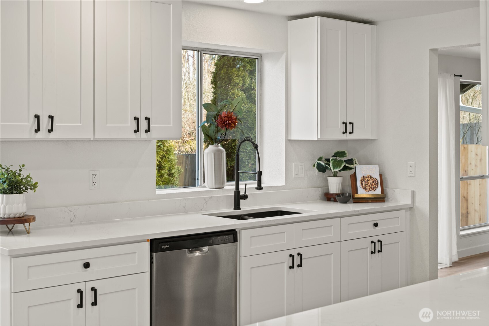 18307 130th Avenue Southeast Renton, WA 98058 - Photo 13 of 36 a kitchen with white cabinets and window