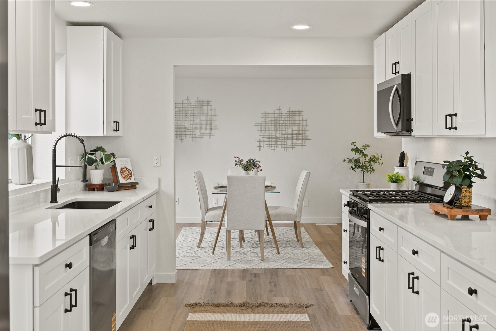 18307 130th Avenue Southeast Renton, WA 98058 - Photo 18 of 36 a white kitchen with sink and white cabinets