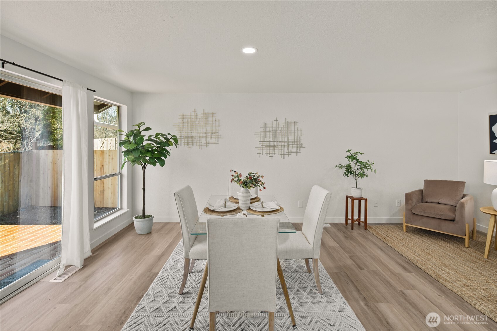 18307 130th Avenue Southeast Renton, WA 98058 - Photo 19 of 36 a view of a dining room with furniture window and wooden floor