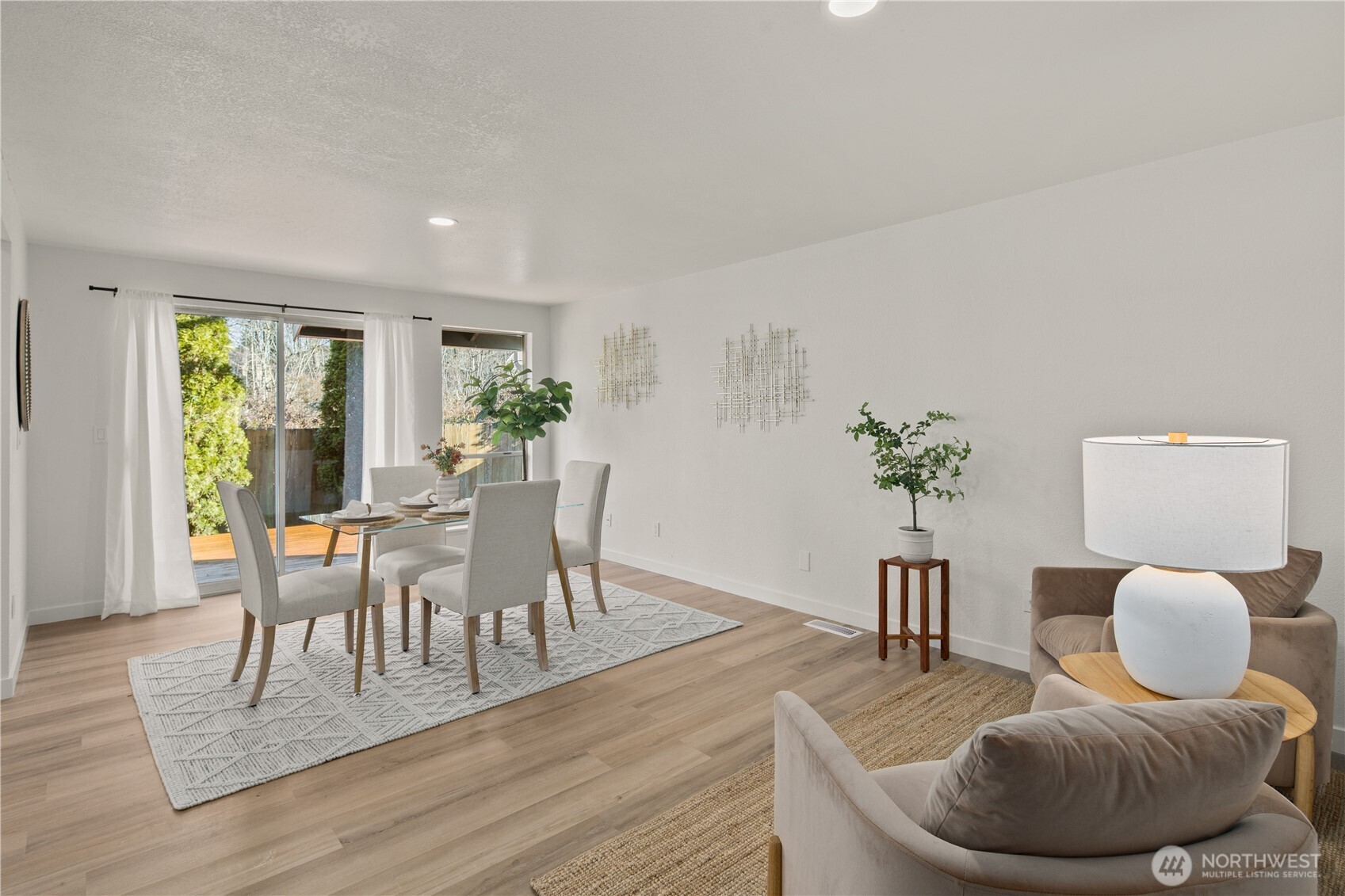 18307 130th Avenue Southeast Renton, WA 98058 - Photo 20 of 36 a dining room with furniture and wooden floor