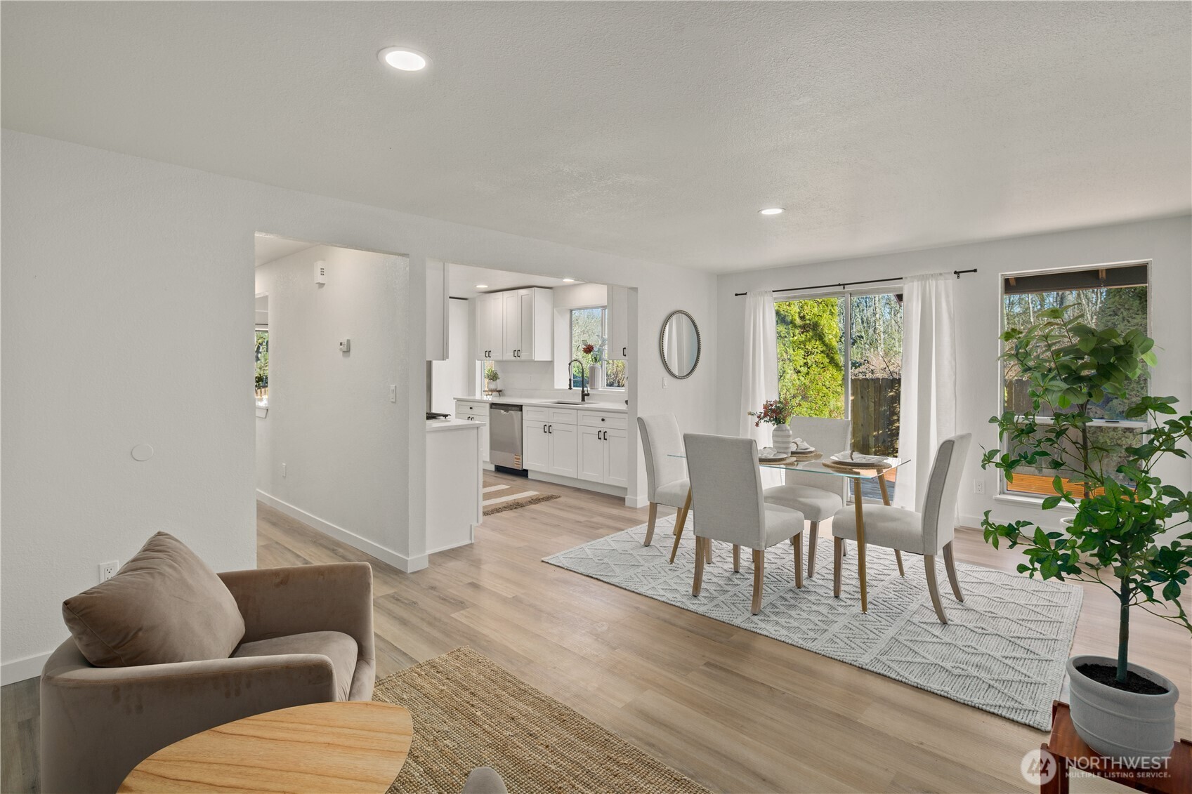 18307 130th Avenue Southeast Renton, WA 98058 - Photo 21 of 36 a living room with furniture and a wooden floor
