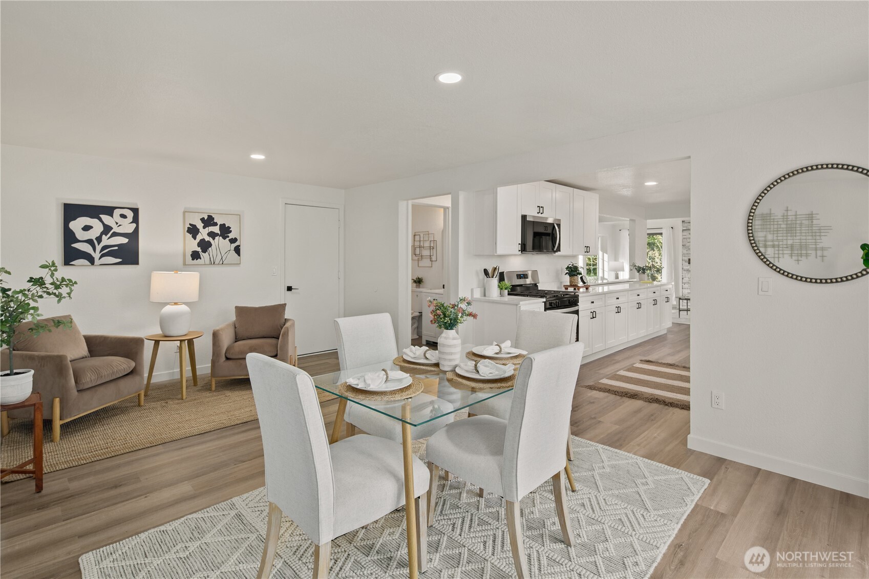 18307 130th Avenue Southeast Renton, WA 98058 - Photo 22 of 36 a view of a dining room with furniture and wooden floor