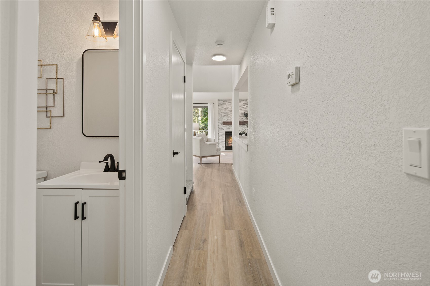18307 130th Avenue Southeast Renton, WA 98058 - Photo 23 of 36 a view of a bathroom from the hallway