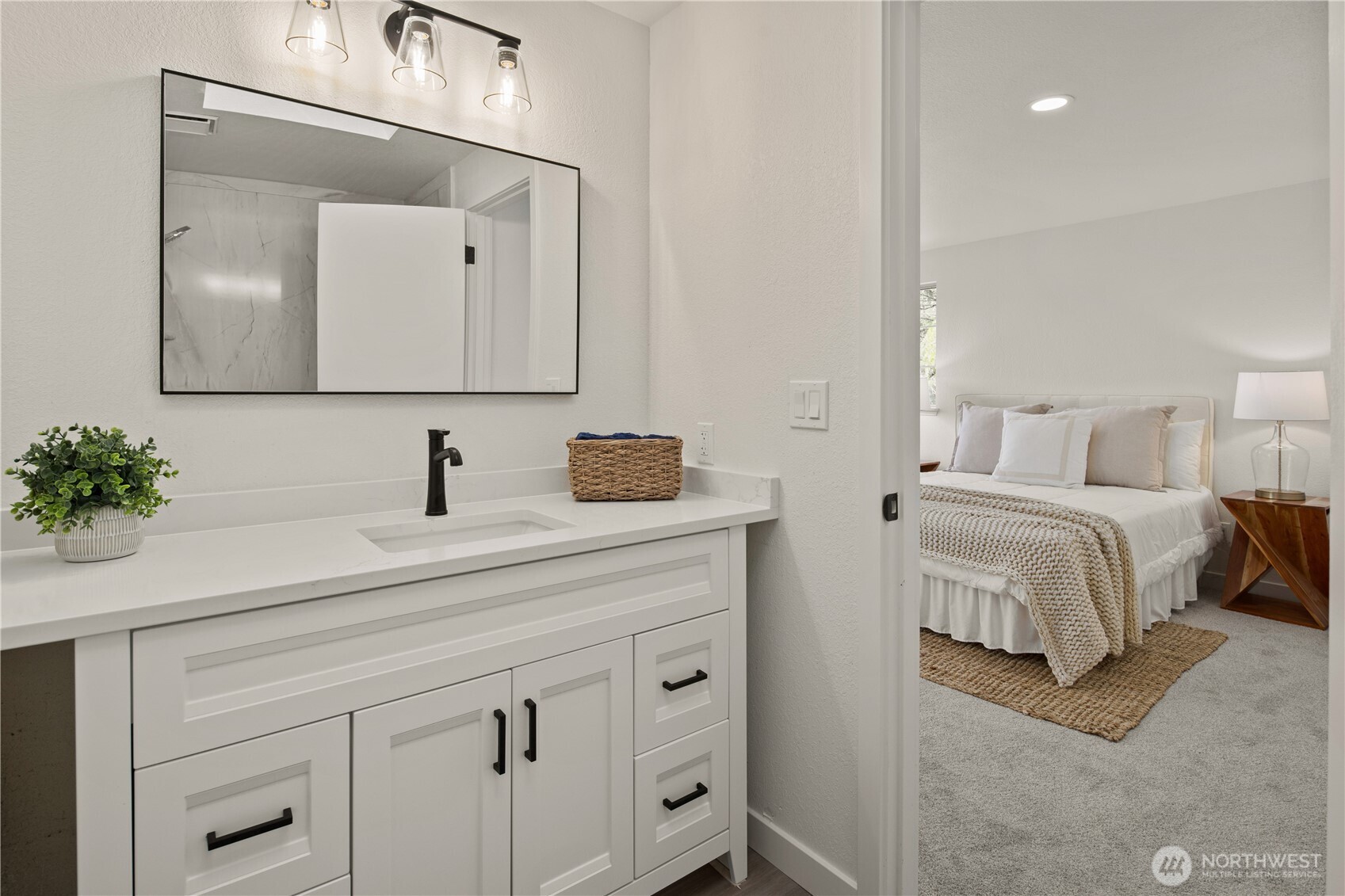 18307 130th Avenue Southeast Renton, WA 98058 - Photo 28 of 36 a bedroom with a bed and a mirror