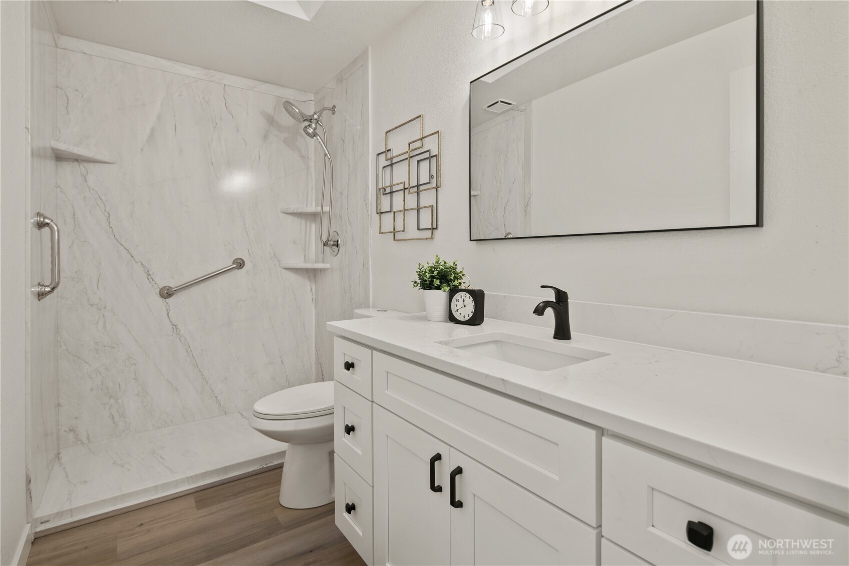 18307 130th Avenue Southeast Renton, WA 98058 - Photo 32 of 36 a bathroom with a sink a toilet and a mirror