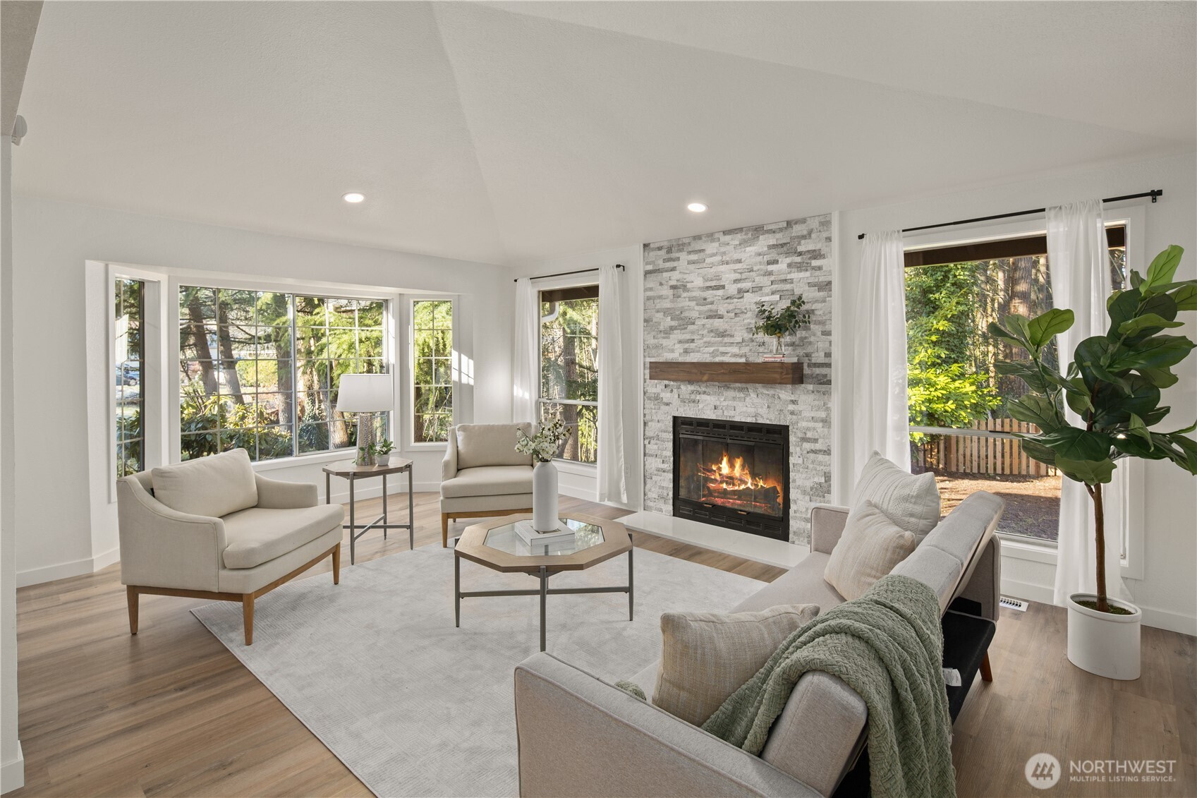 18307 130th Avenue Southeast Renton, WA 98058 - Photo 4 of 36 a living room with furniture and a fireplace