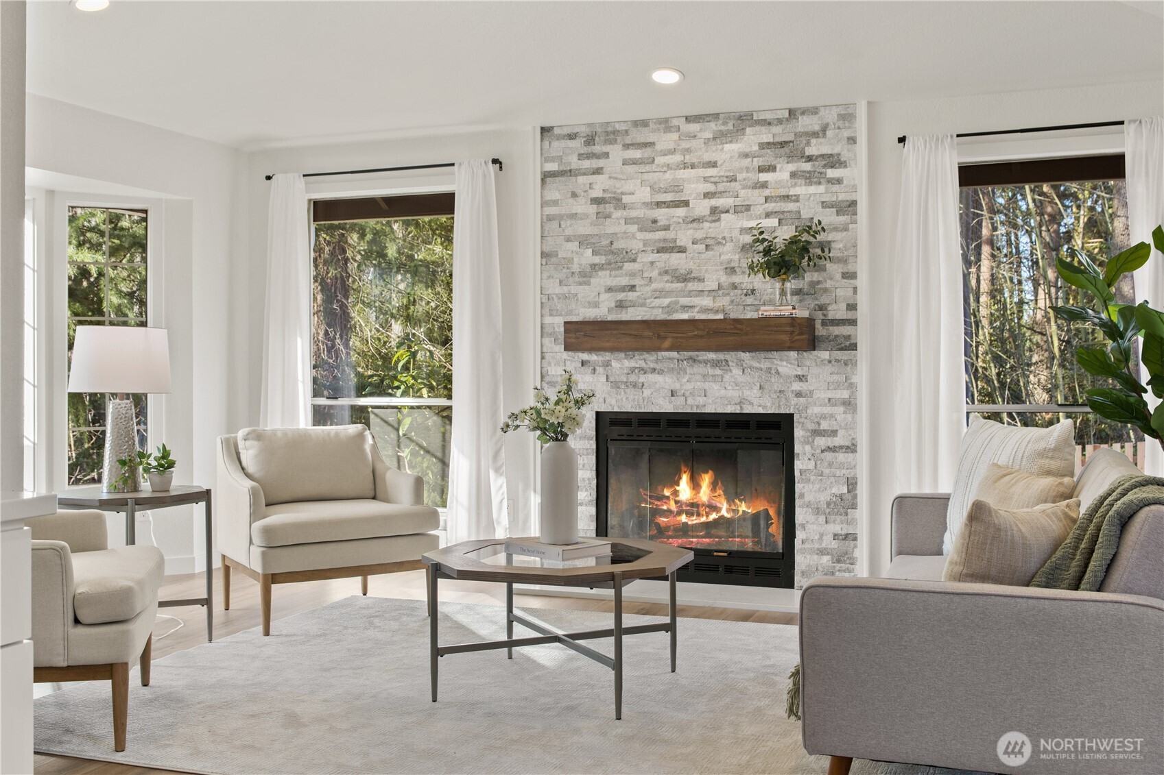 18307 130th Avenue Southeast Renton, WA 98058 - Photo 5 of 36 a living room with furniture and a fireplace