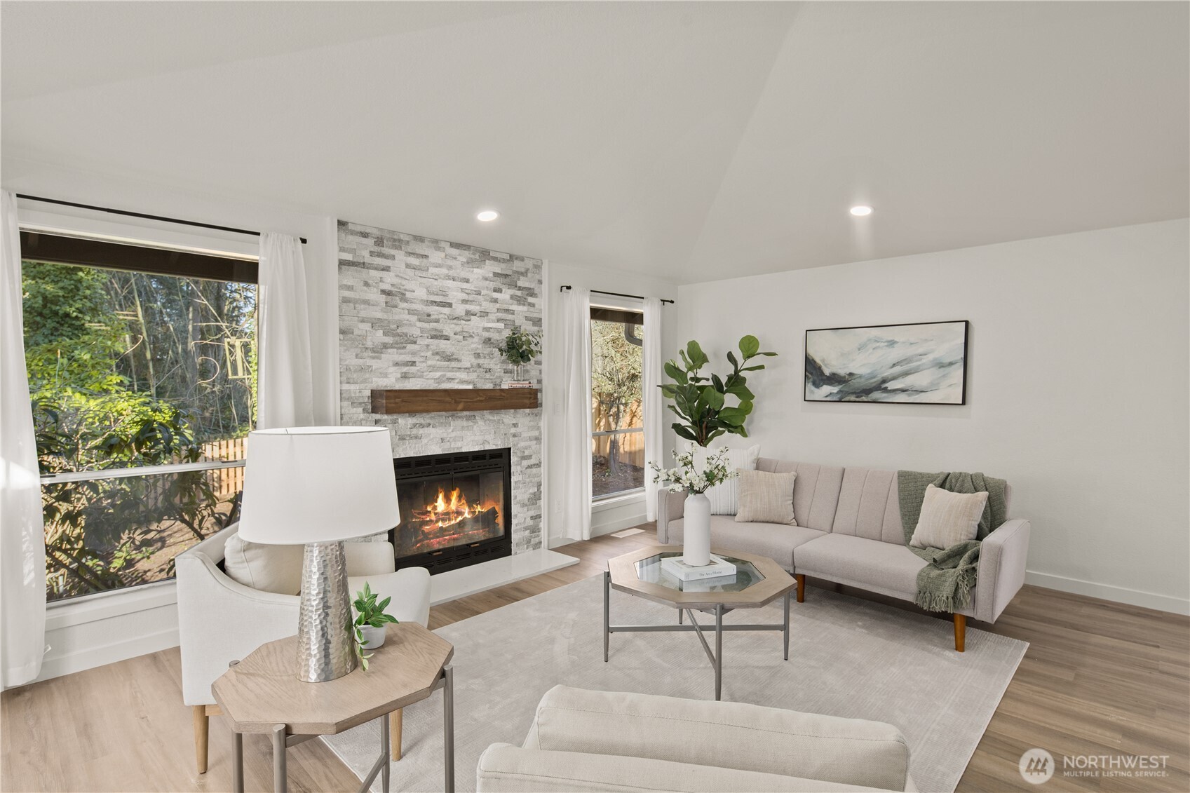 18307 130th Avenue Southeast Renton, WA 98058 - Photo 6 of 36 a living room with furniture a fireplace and a large window