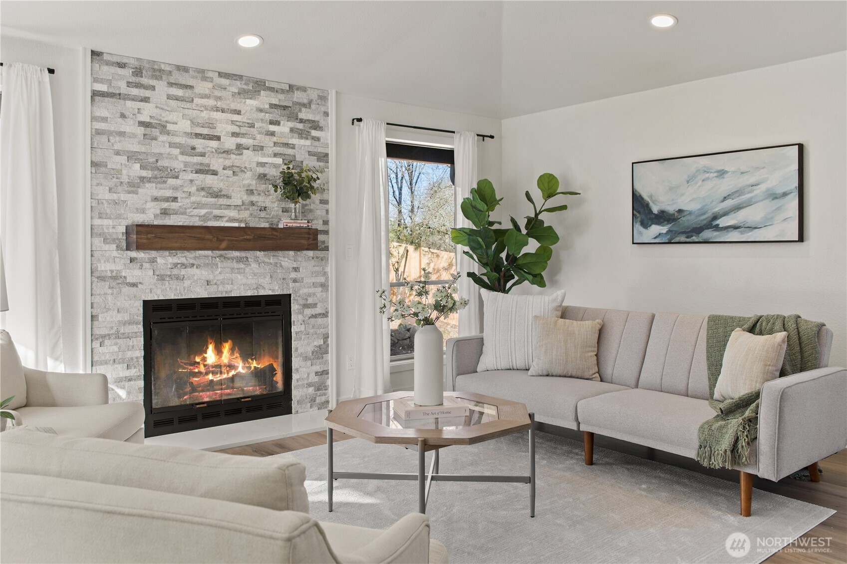 18307 130th Avenue Southeast Renton, WA 98058 - Photo 7 of 36 a living room with furniture and a fireplace
