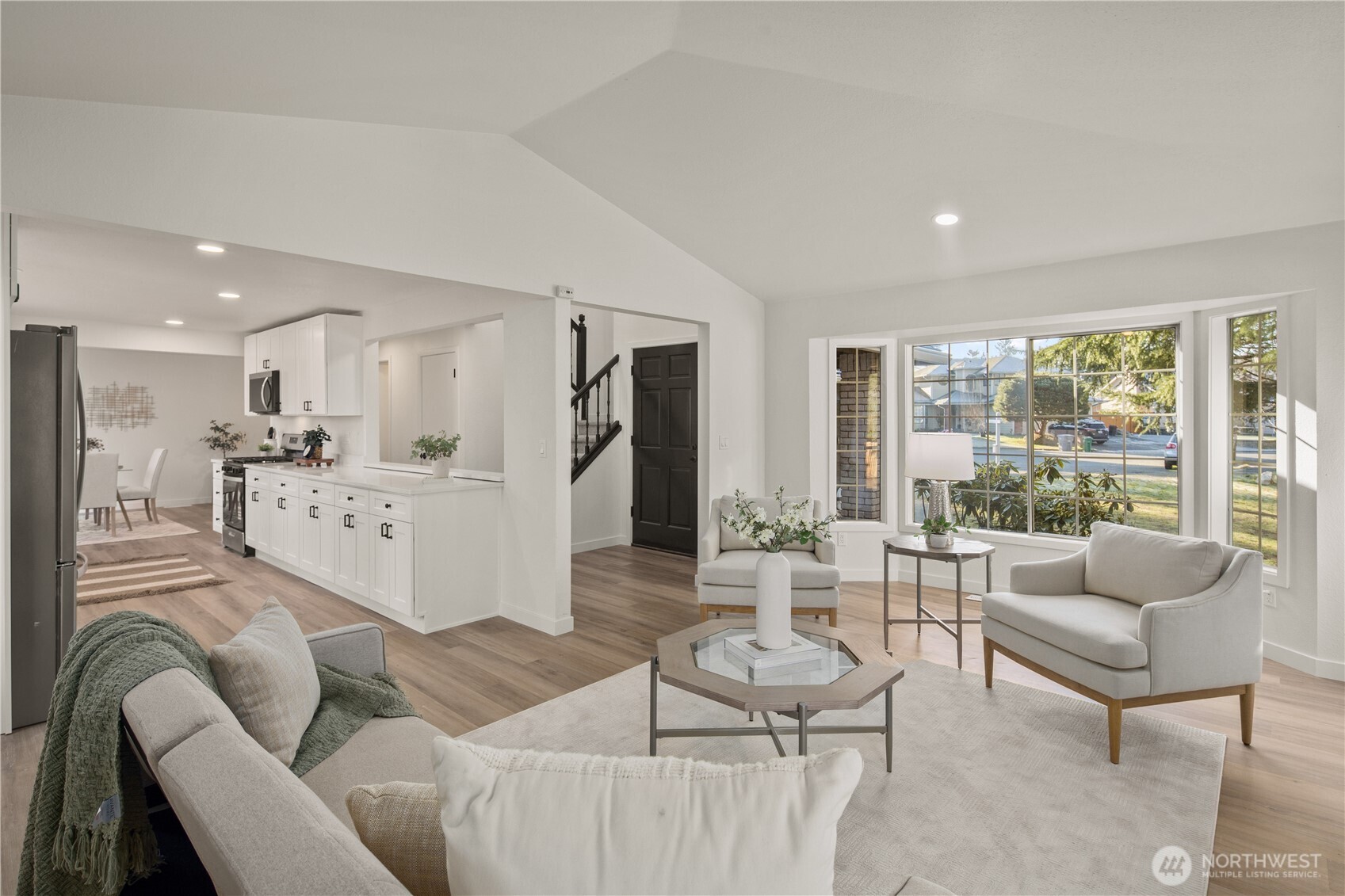 18307 130th Avenue Southeast Renton, WA 98058 - Photo 8 of 36 a living room with furniture and a large window