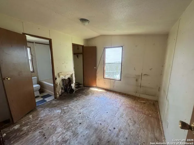 an empty room with windows