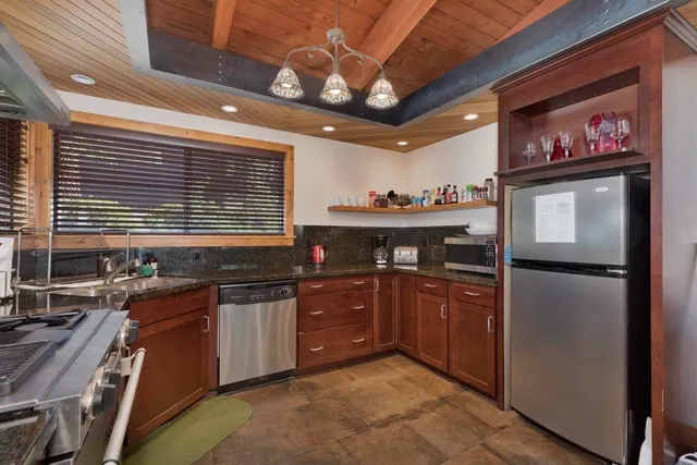 a view of a hallway with wooden floor and entryway