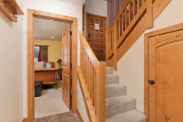 a bedroom with a bed and dresser