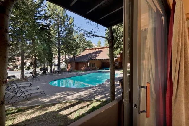 a bedroom with a bed and a dresser in it