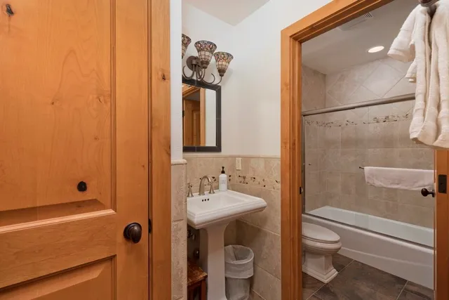 a bed room with a bed and washer